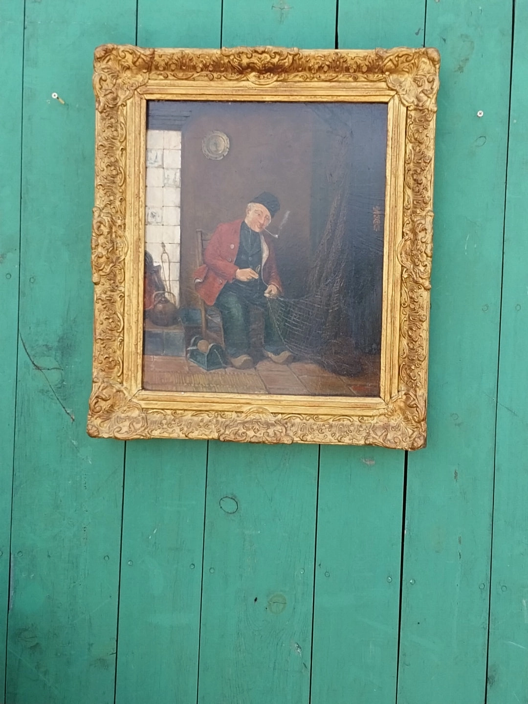19TH CENTURY GILT FRAMED OIL PAINTING OF INTERIOR WITH DUTCHMAN