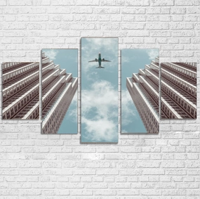 Airplane Flying over Big Buildings Printed Multiple Canvas Poster canvas mural art