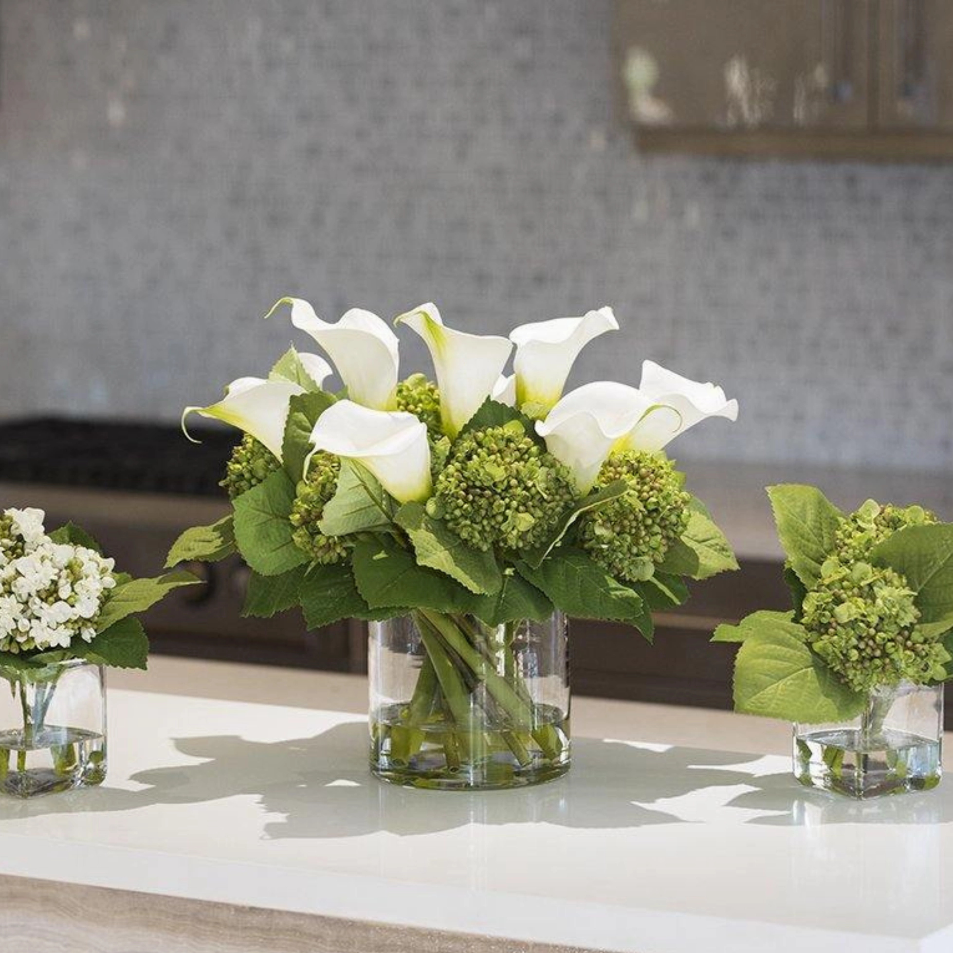 Calla Lily & Hydrangea White Buds Arrangement in Clear Cylinder Vase