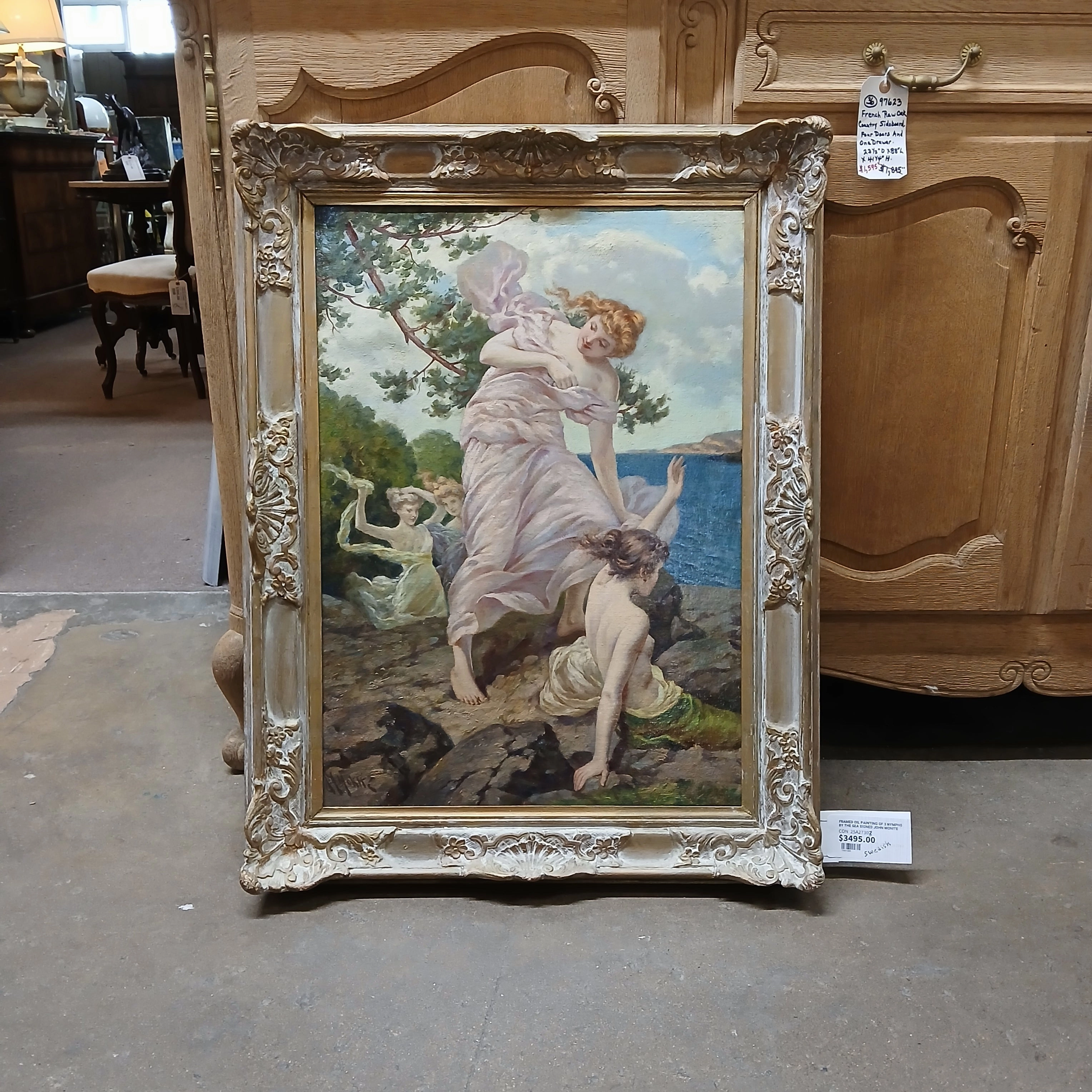 FRAMED OIL PAINTING OF 3 NYMPHS BY THE SEA SIGNED JOHN MONITE