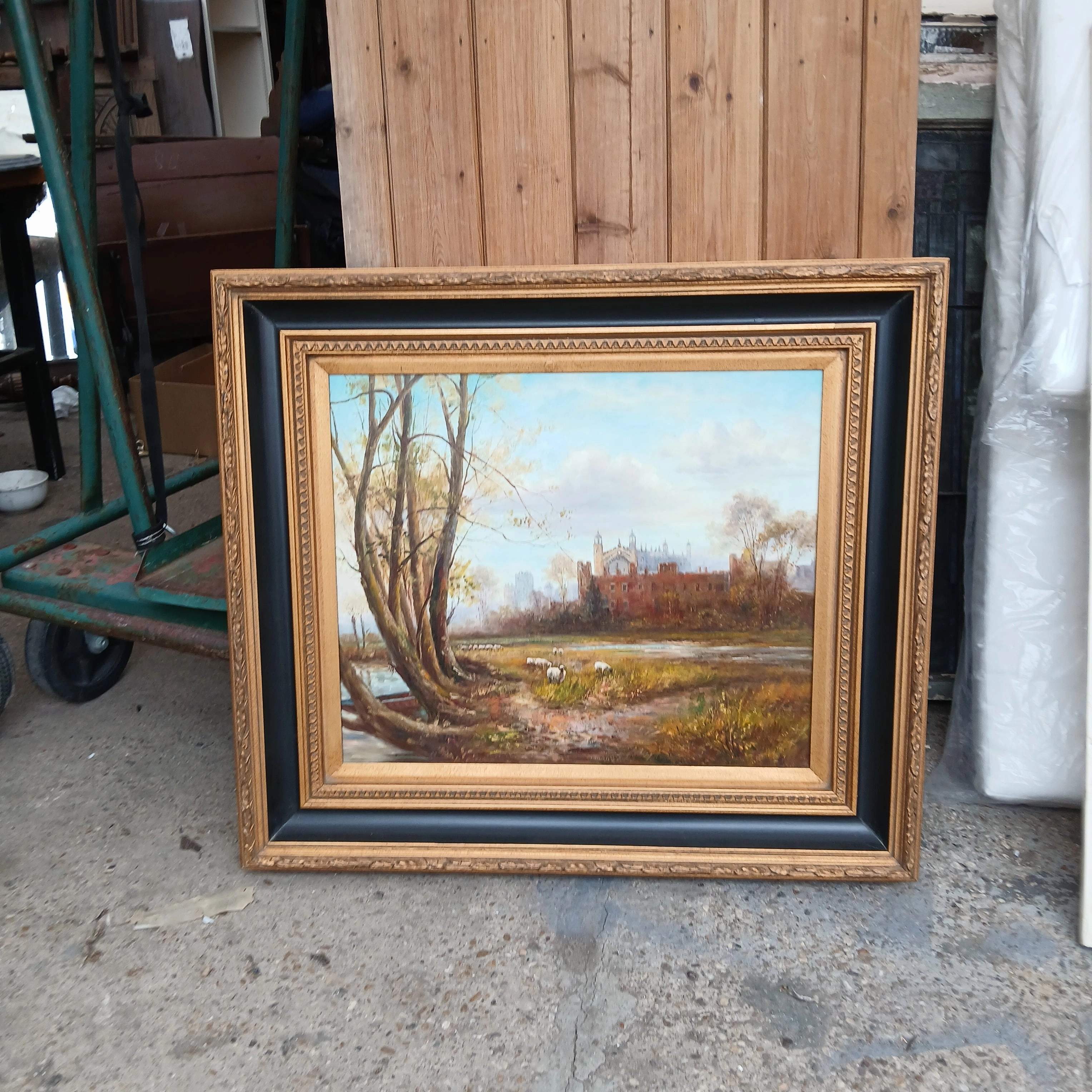 FRAMED OIL PAINTING OF CASTLE WITH SHEEP