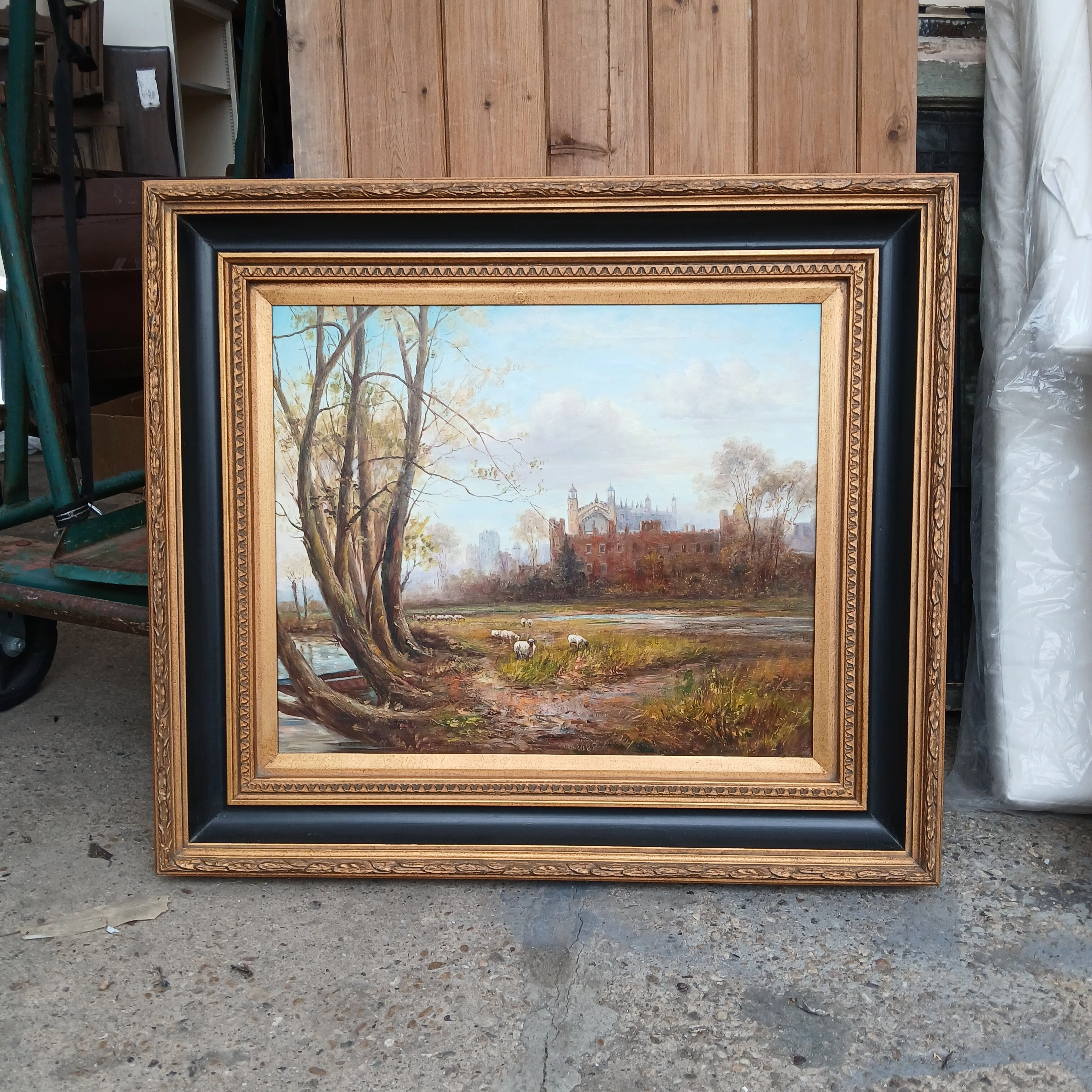 FRAMED OIL PAINTING OF CASTLE WITH SHEEP