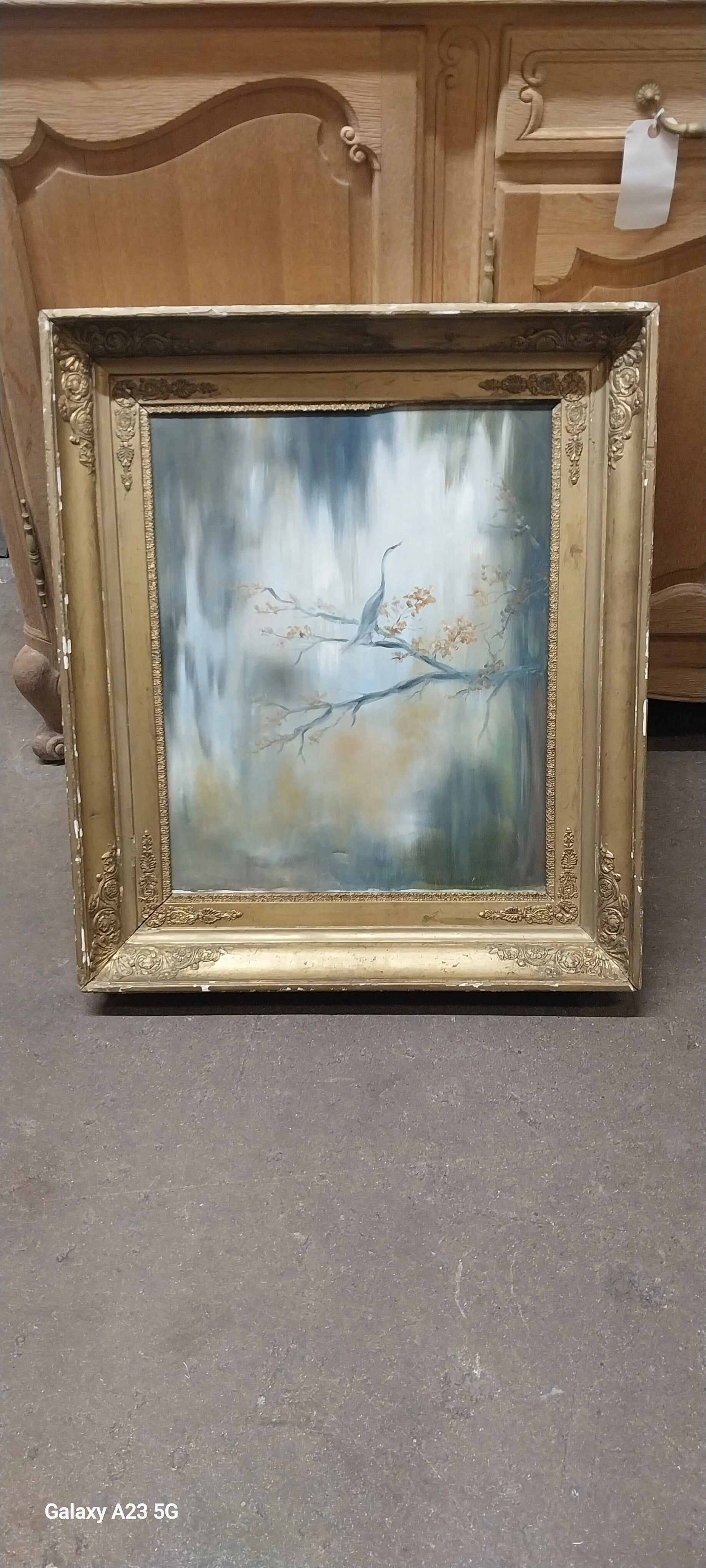 GOLD FRAMED OIL PAINTING OF CRANE ON TREE BRANCH