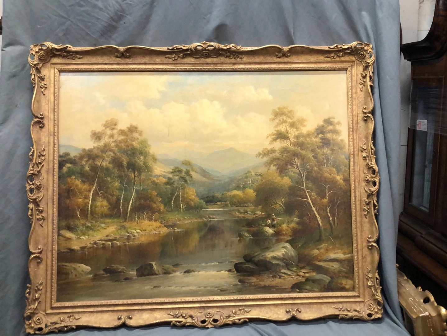 ORNATE FRAMED LANDSCAPE OIL PAINTING OF RIVER AND MOUNTAINS WITH COUPLE FISHING