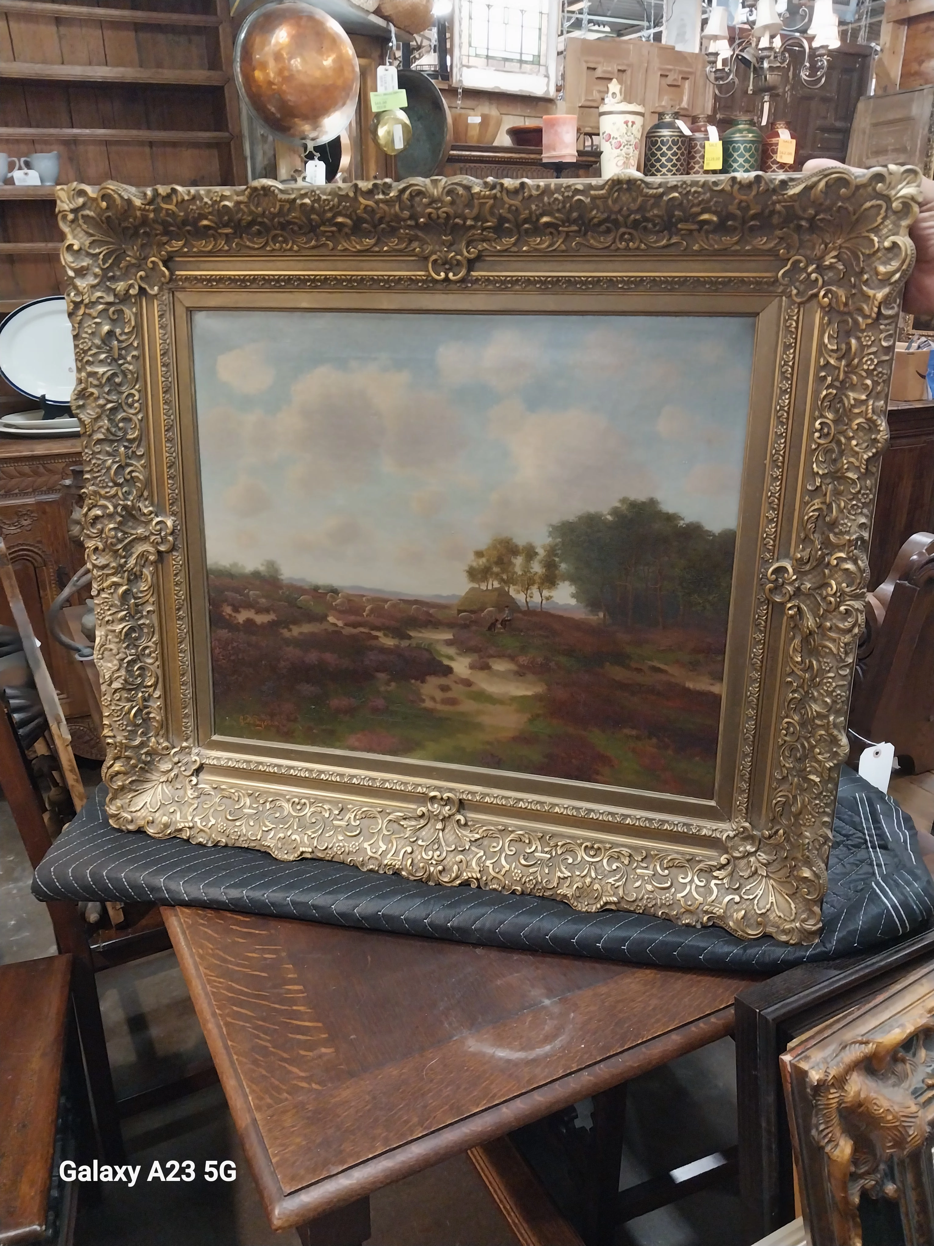 ORNATELY FRAMED LANDSCAPE OIL PAINTING WITH SHEEP
