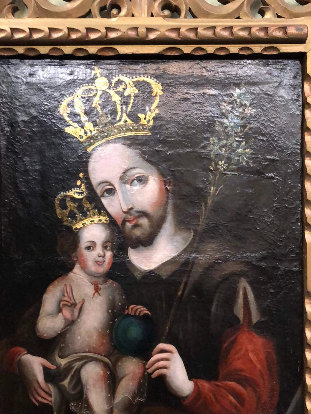 SPANISH COLONIAL SAINT OIL PAINTING WITH JESUS IN PIERCE CARVED FRAME