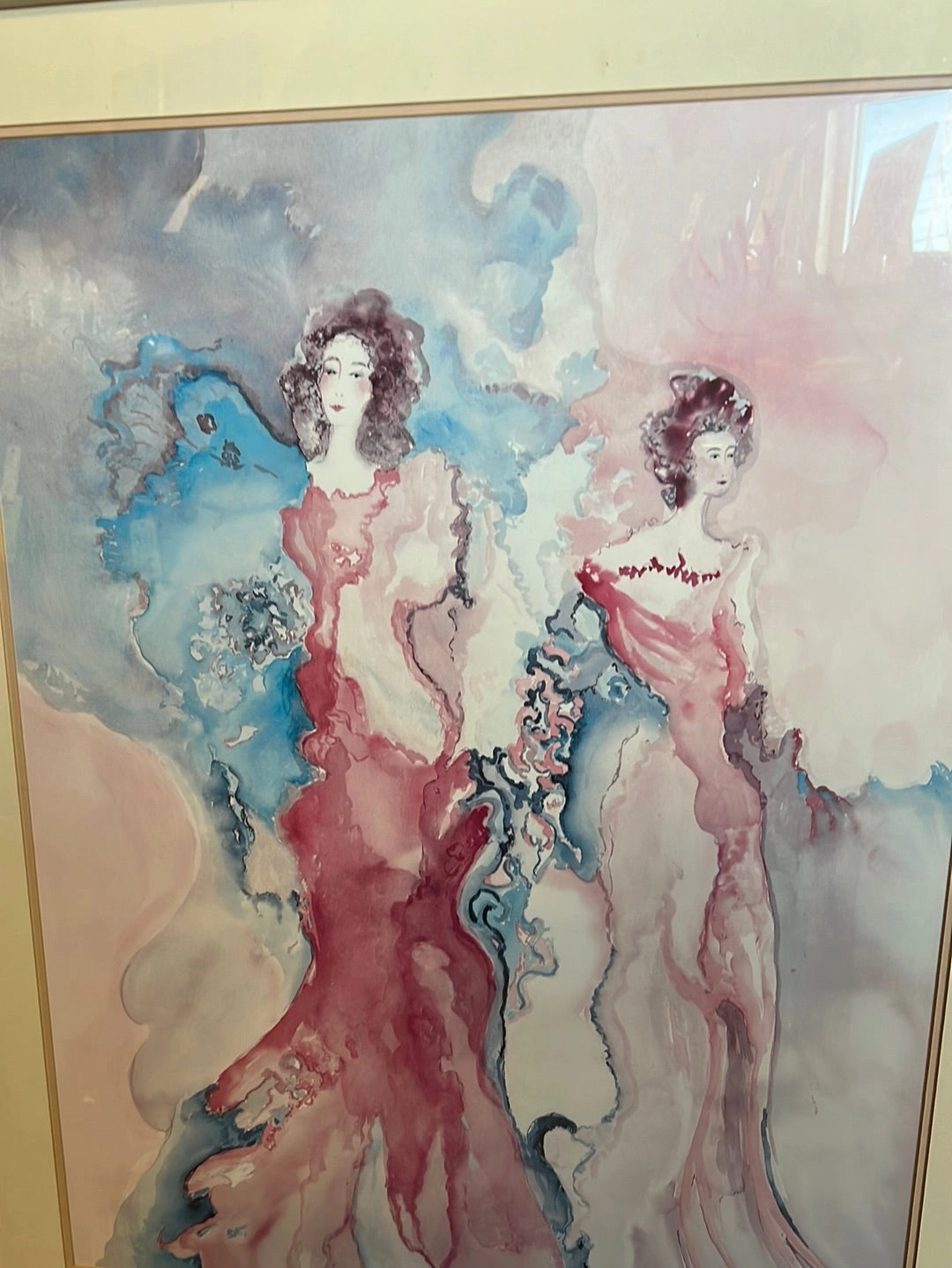 WATERCOLOR OF TWO WOMEN IN GLASS WITH CREAM COLOR FRAME